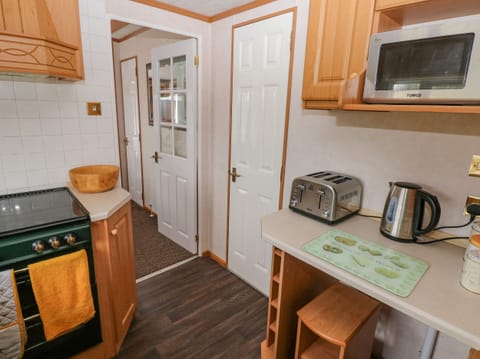 Fridge, electric kettle, toaster, cookware/dishes/utensils