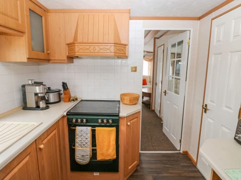 Fridge, electric kettle, toaster, cookware/dishes/utensils