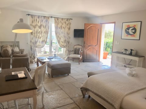 Deluxe Room, Balcony | Minibar, in-room safe, desk, soundproofing