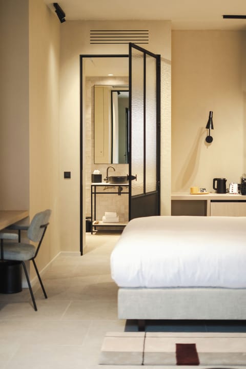 The Homey | Bathroom | Shower, rainfall showerhead, hair dryer, towels