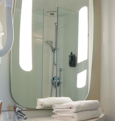 Shower, eco-friendly toiletries, hair dryer, towels