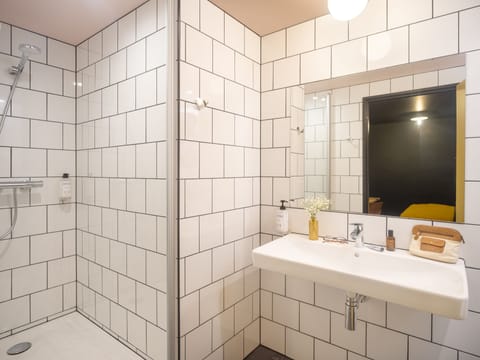 Shower, eco-friendly toiletries, towels, soap