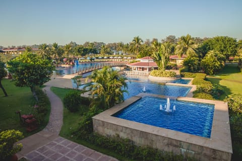 Outdoor pool, open 7:00 AM to 7:00 PM, pool umbrellas, sun loungers