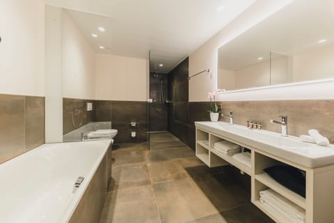 Executive Suite (Boutique) | Bathroom | Separate tub and shower, deep soaking tub, rainfall showerhead