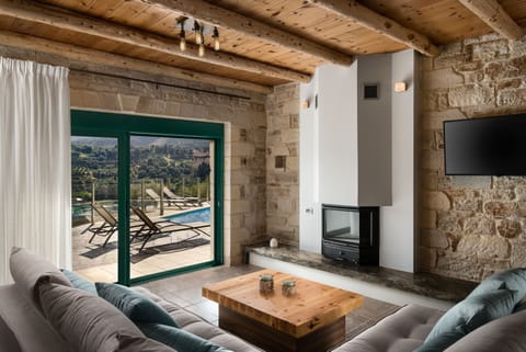 Deluxe Villa, 2 Bedrooms, Mountain View, Mountainside | Living area | 55-inch Smart TV with satellite channels, TV, fireplace