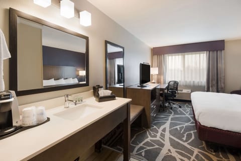 Desk, laptop workspace, blackout drapes, iron/ironing board