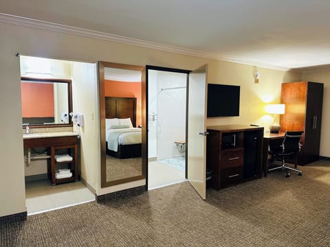 Family Room, 2 Queen Beds, Roll-in Shower | Pillowtop beds, in-room safe, desk, blackout drapes