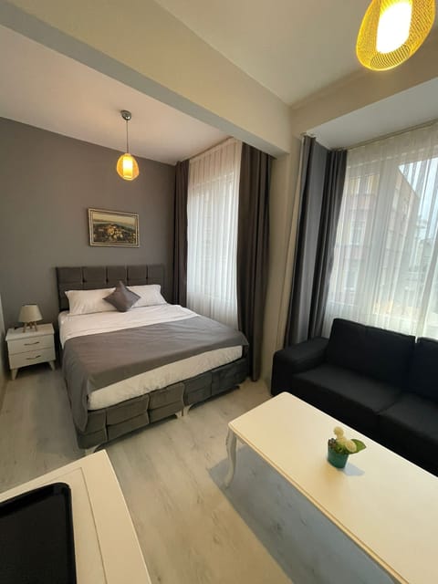 Standard Quadruple Room | Minibar, in-room safe, soundproofing, iron/ironing board