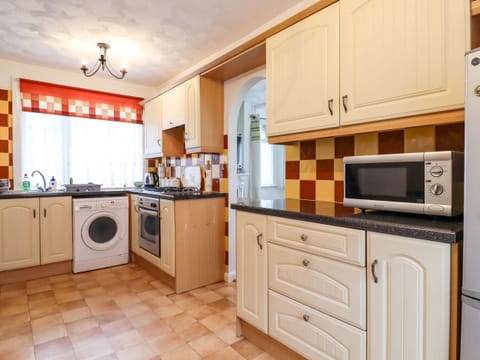 Fridge, electric kettle, toaster, cookware/dishes/utensils