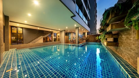 Outdoor pool, a waterfall pool, sun loungers