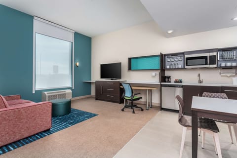 Suite, 1 Bedroom | Living area | 32-inch TV with cable channels