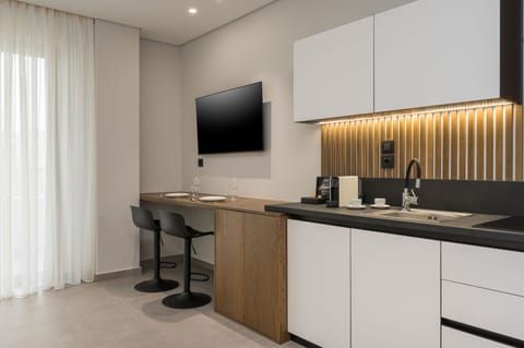 Mini-fridge, stovetop, espresso maker, coffee/tea maker