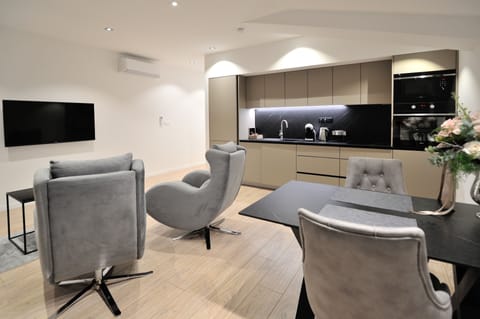 Exclusive Apartment, 2 Twin Beds, Non Smoking, Courtyard Area | Living area | 56-inch Smart TV with cable channels, TV