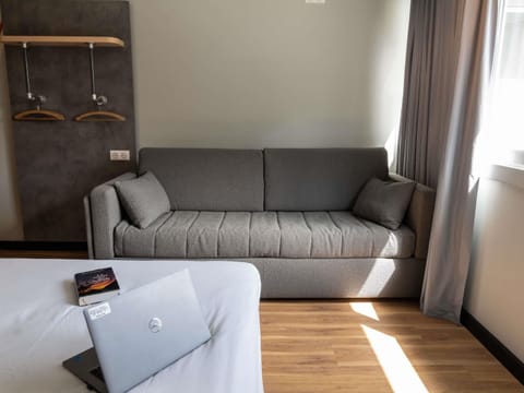 Desk, laptop workspace, blackout drapes, soundproofing