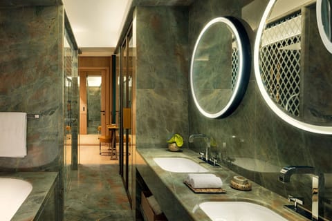 Junior Suite, 1 Bedroom, City View | Bathroom | Separate tub and shower, rainfall showerhead, designer toiletries