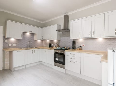 Fridge, electric kettle, toaster, cookware/dishes/utensils