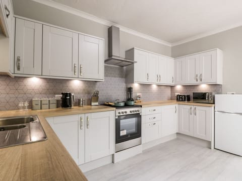 Fridge, electric kettle, toaster, cookware/dishes/utensils