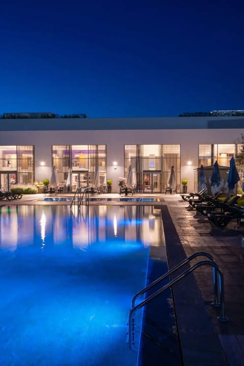 Indoor pool, outdoor pool, pool umbrellas, sun loungers