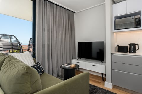Gallery Apartment | Living area | 50-inch flat-screen TV with cable channels, TV, Netflix
