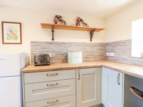 Fridge, electric kettle, toaster, cookware/dishes/utensils