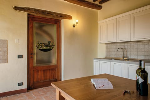 Condo | Private kitchen | Fridge, stovetop, cookware/dishes/utensils, cleaning supplies