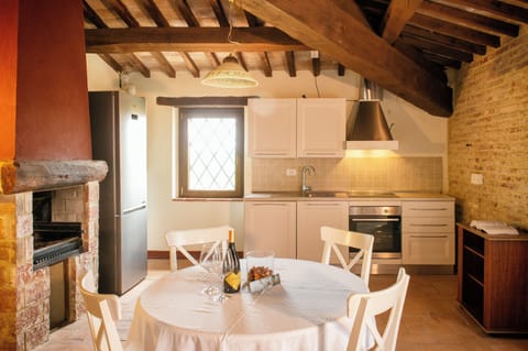 Condo | Private kitchen | Fridge, stovetop, cookware/dishes/utensils, cleaning supplies