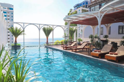 Outdoor pool, open 6:30 AM to 10:00 PM, pool umbrellas