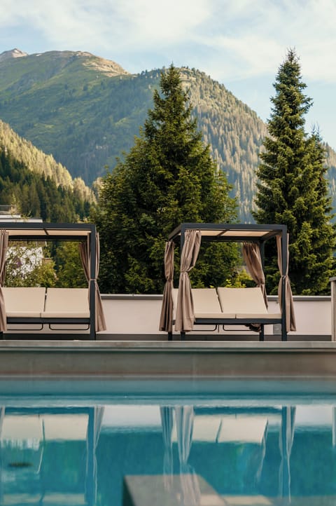 Indoor pool, seasonal outdoor pool, pool umbrellas, sun loungers