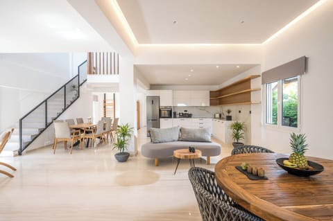 Superior Villa | Living area | 20-inch TV with satellite channels