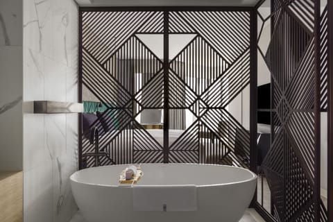 Separate tub and shower, rainfall showerhead, free toiletries