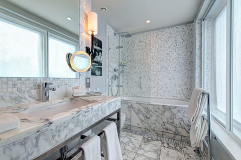 Shower, designer toiletries, hair dryer, bathrobes