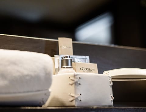 Designer toiletries, hair dryer, bathrobes, slippers