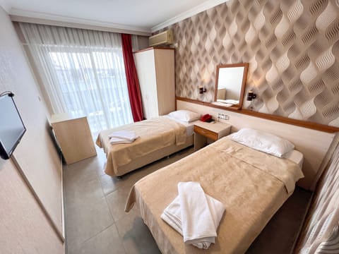 City Twin Room | Minibar, blackout drapes, free WiFi, bed sheets