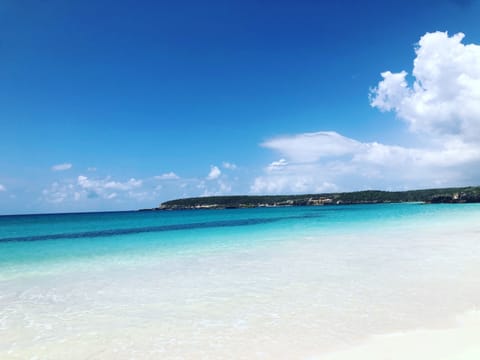 Beach nearby, white sand, beach towels