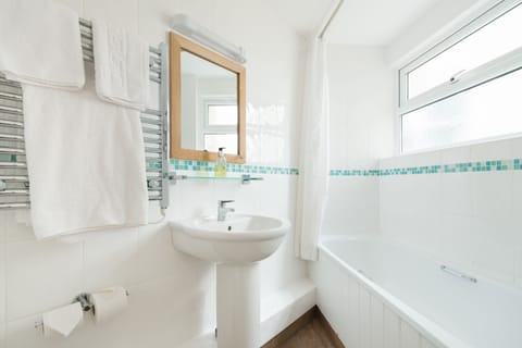 Shower, designer toiletries, hair dryer, towels