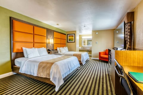 Suite, 2 Queen Beds, Non Smoking | Blackout drapes, free cribs/infant beds, free rollaway beds, free WiFi