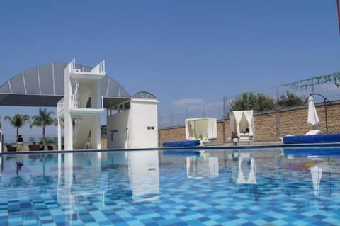 Outdoor pool, open 7:00 AM to 8:00 PM, pool umbrellas, sun loungers