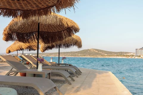 Private beach nearby, white sand, sun loungers, beach umbrellas
