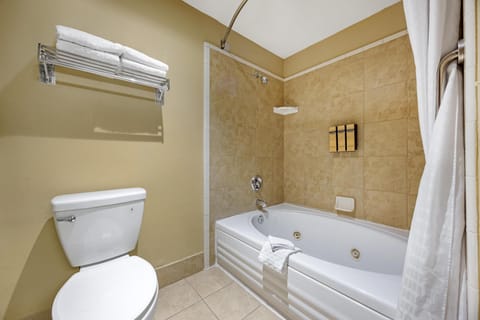 Suite, 2 Queen Beds, Non Smoking, Jetted Tub (with Sofabed) | Bathroom | Combined shower/tub, free toiletries, hair dryer, towels