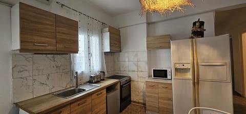 Family Apartment | Private kitchen | Fridge, microwave, coffee/tea maker, dining tables