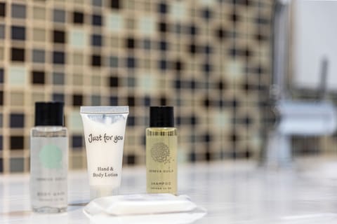 Comfort Room, Accessible | Bathroom | Hair dryer, towels, soap, shampoo