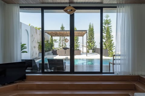 Luxury Villa | Living area | 42-inch Smart TV with cable channels