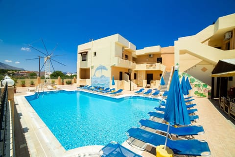 Seasonal outdoor pool, open 9:00 AM to 7:00 PM, pool umbrellas