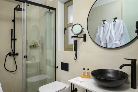 Superior Suite - Split Level | Bathroom | Shower, hair dryer, bathrobes, slippers