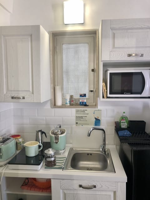 Family room with private batrhoom | Private kitchen | Full-size fridge, microwave, stovetop, espresso maker