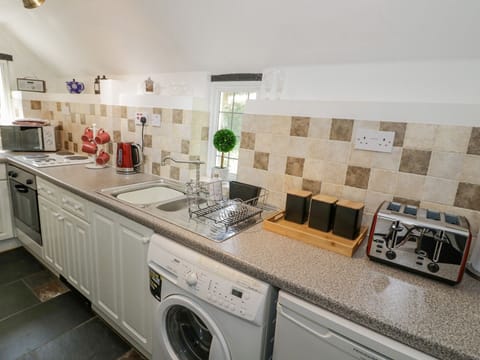 Fridge, electric kettle, toaster, cookware/dishes/utensils