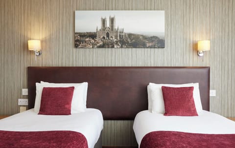 Twin Room | Desk, blackout drapes, iron/ironing board, free cribs/infant beds