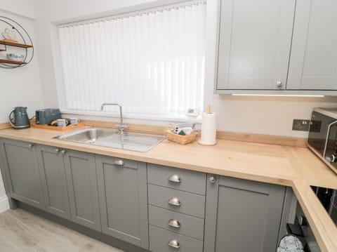 Fridge, electric kettle, toaster, cookware/dishes/utensils