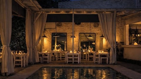 Breakfast, lunch, dinner served; international cuisine, pool views 