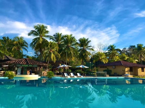 Outdoor pool, open 10:00 AM to 9:00 PM, pool umbrellas